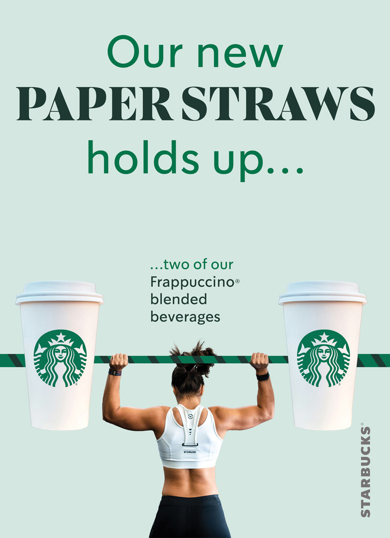 Starbucks paper straw advertisement variant 1. Depicting a woman lifting two large starbucks cups on a paper straw barbell. 'Our new paper straws hold up...' tagline.
